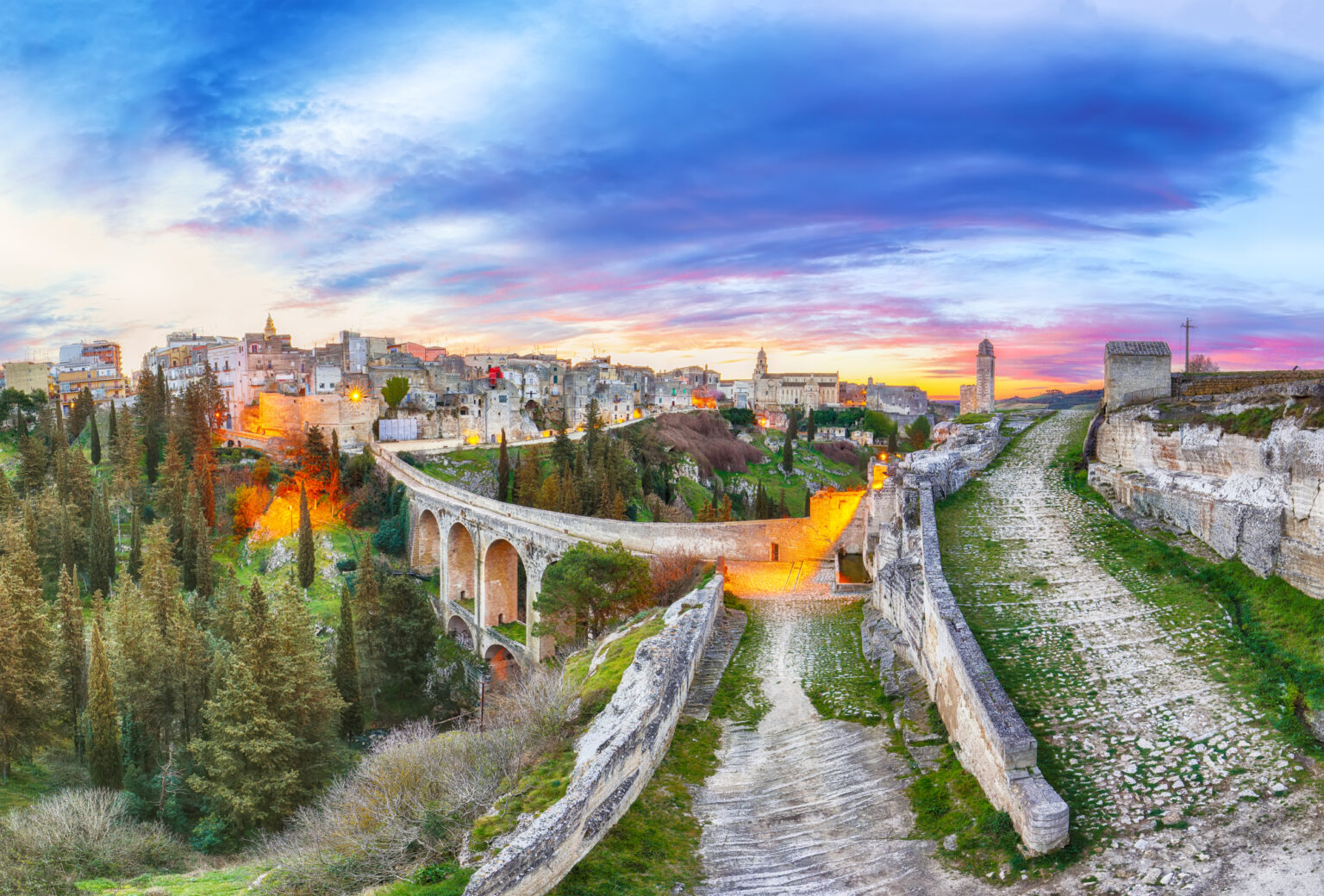 Gravina in Puglia ancient town, bridge and canyon at sunrise